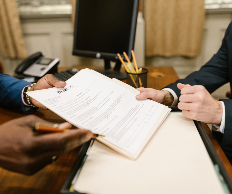 Person signing a divorce agreement